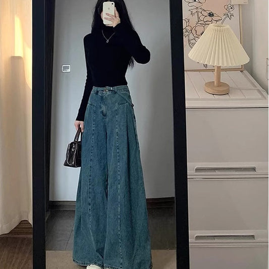 Woman wearing loose-fit high-waist wide-leg floor-length denim-style pants